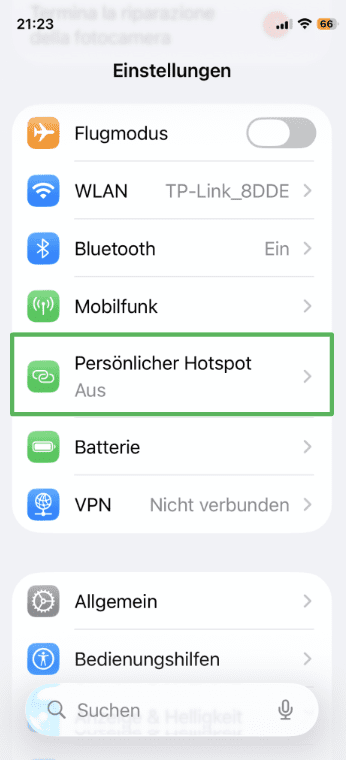 iPhone settings menu with Personal Hotspot highlighted.