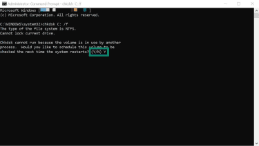 The Windows 11 Command Prompt app. A reply to a CHKDSK-initiated question is typed in.